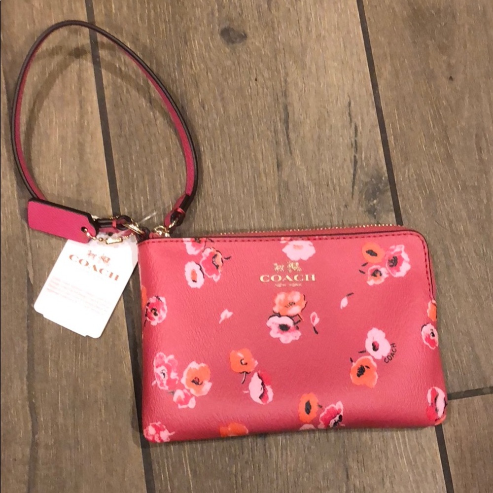 Pink little Coach wristlet wallet